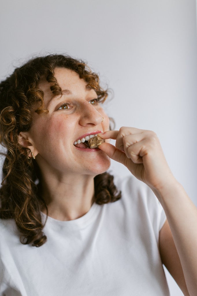 A customer eating a Seen calcium chew